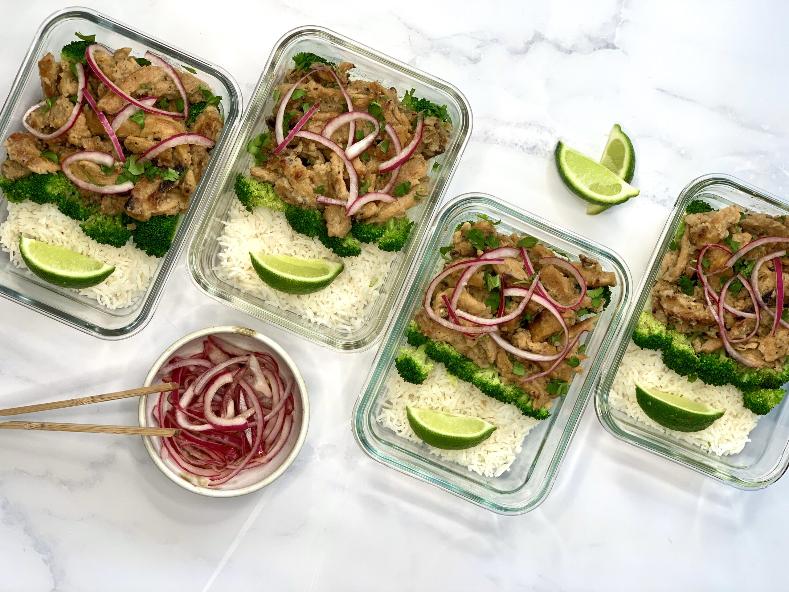 coconut lime soy curl meal prep containers with side of pickled red onion. 