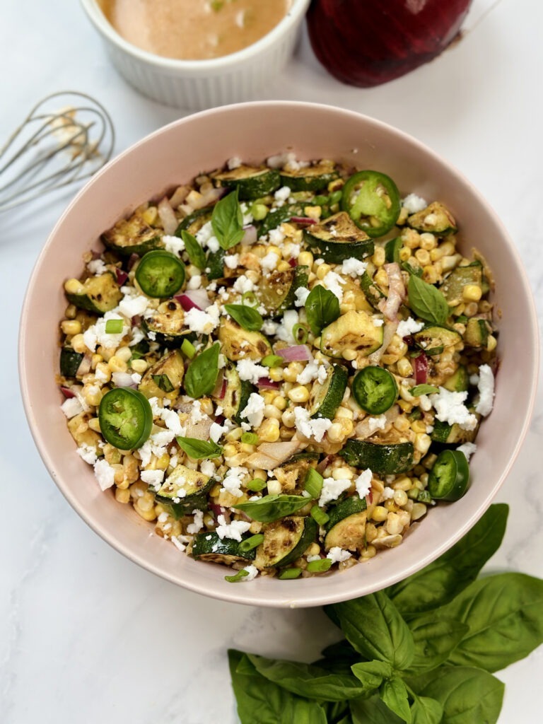 zucchini and corn salad with basil and feta topper