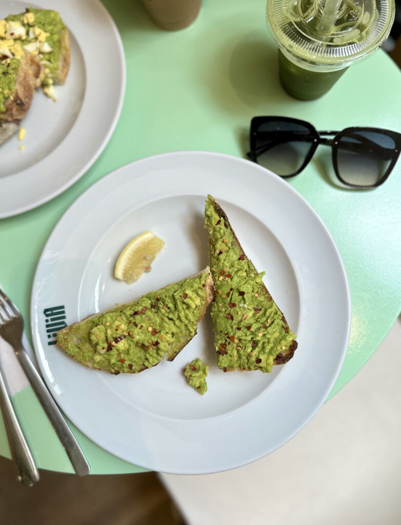 cafe livia vegan avocado toast slices with lemon wedge