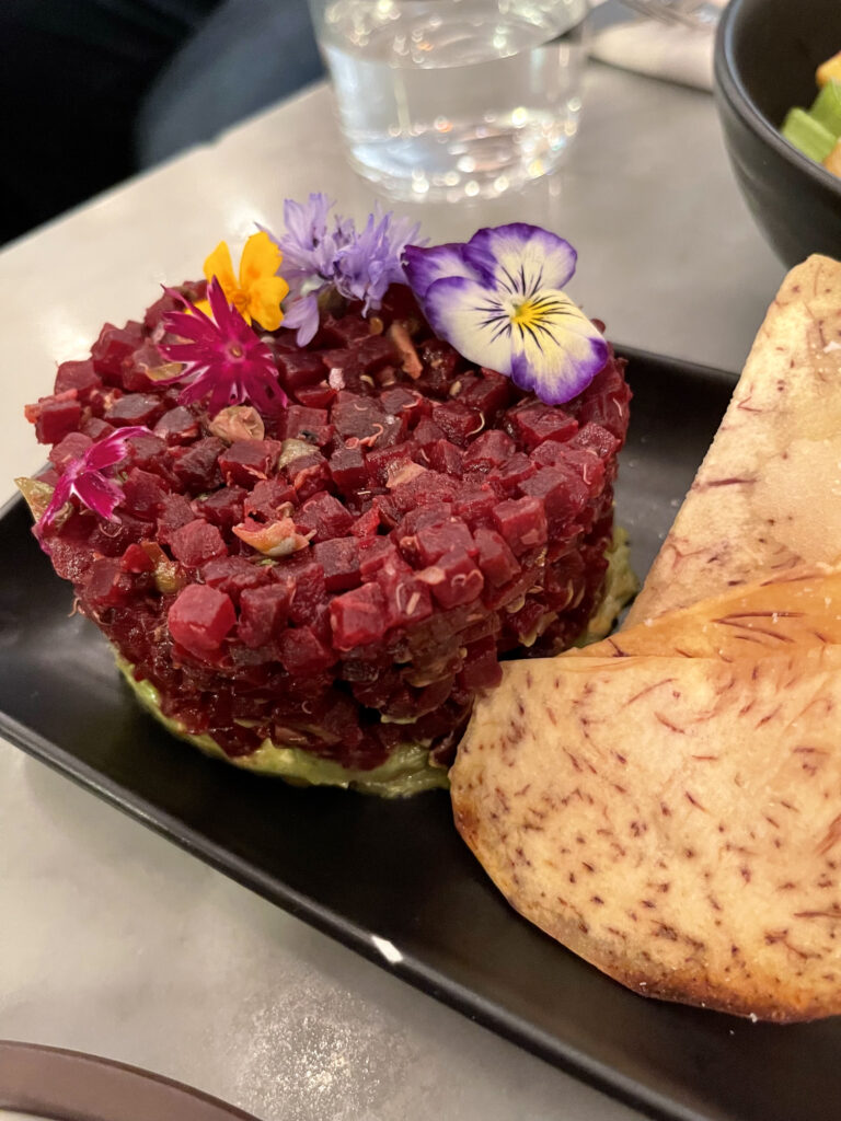 vegan food from lov - beet tartare garnished with flowers