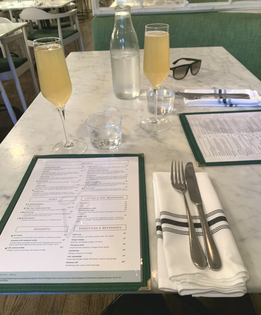 vegan brunch menu and table set up from love. menus, napkins and mocktails