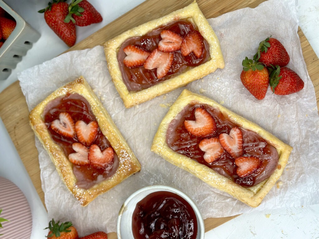 3 pastries on cutting board 