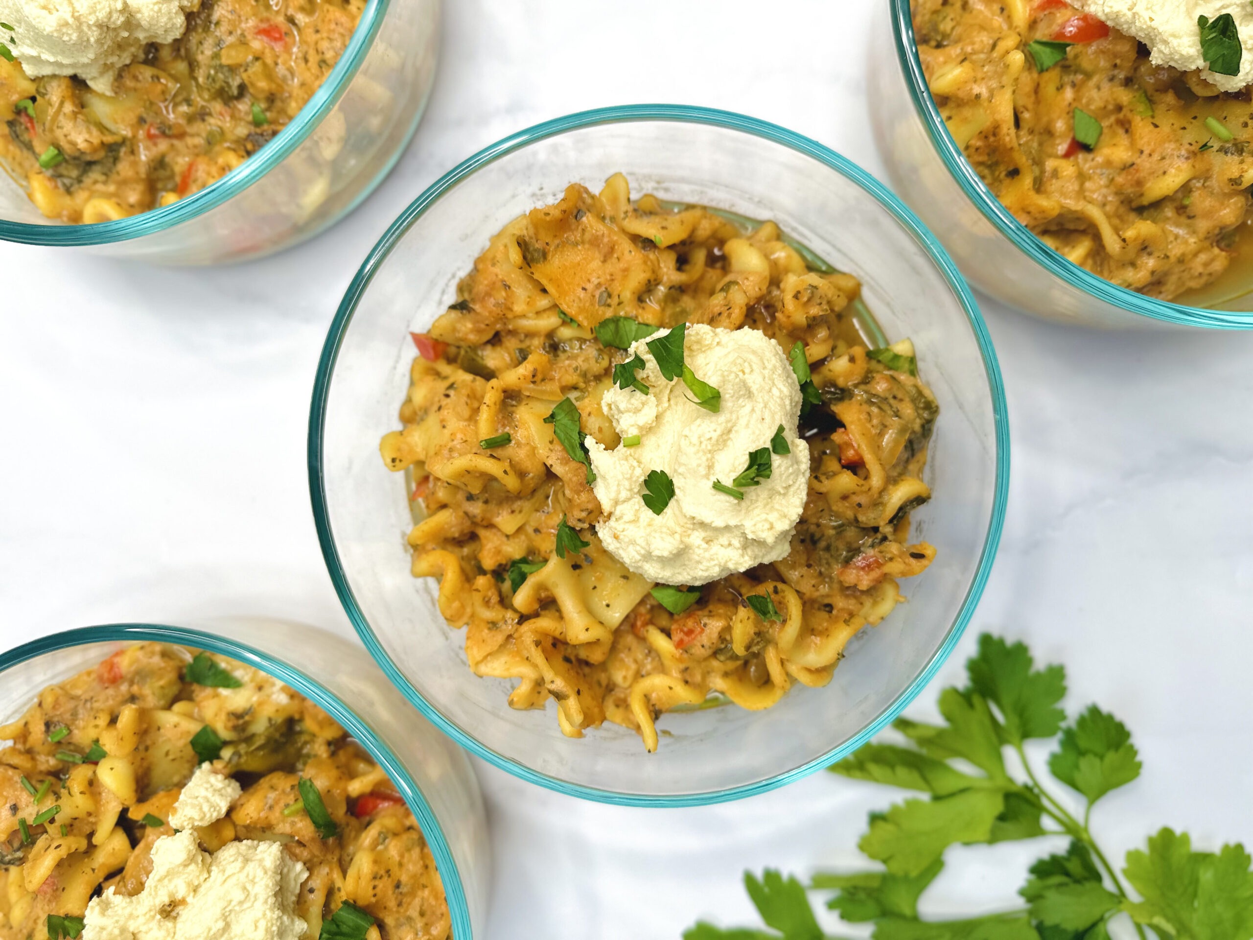 meal prep container with lasagna soup with tofu ricotta on top