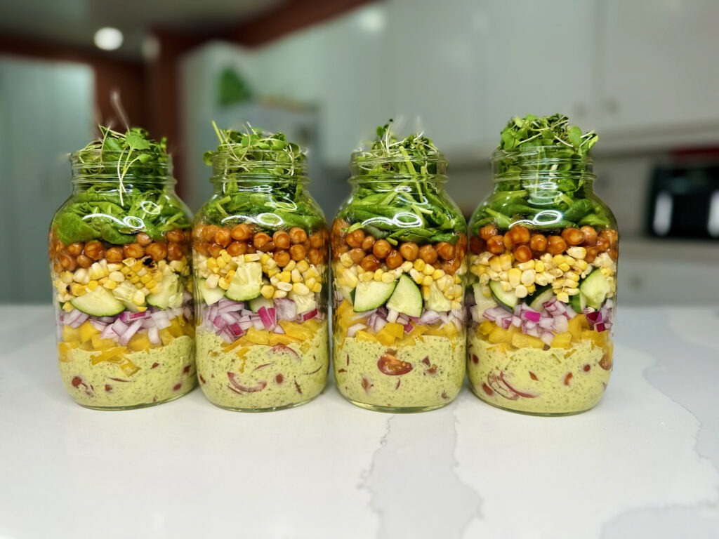 4 meal prep salad jars filled 