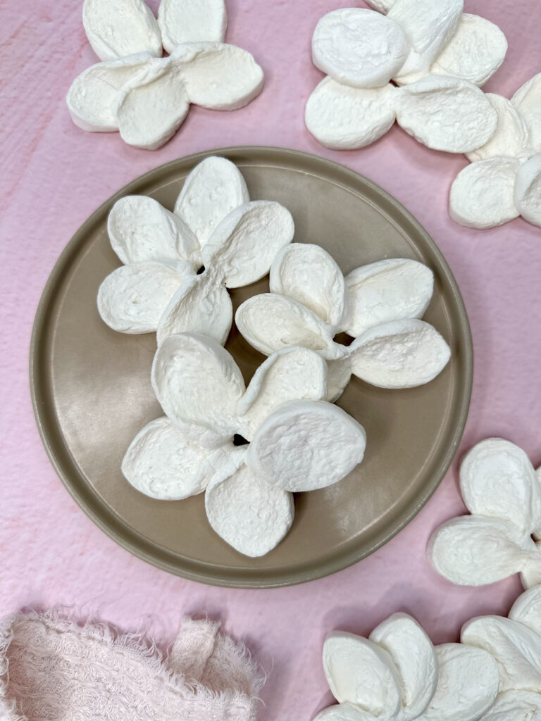 small brown plate with baked marshmallow flowers