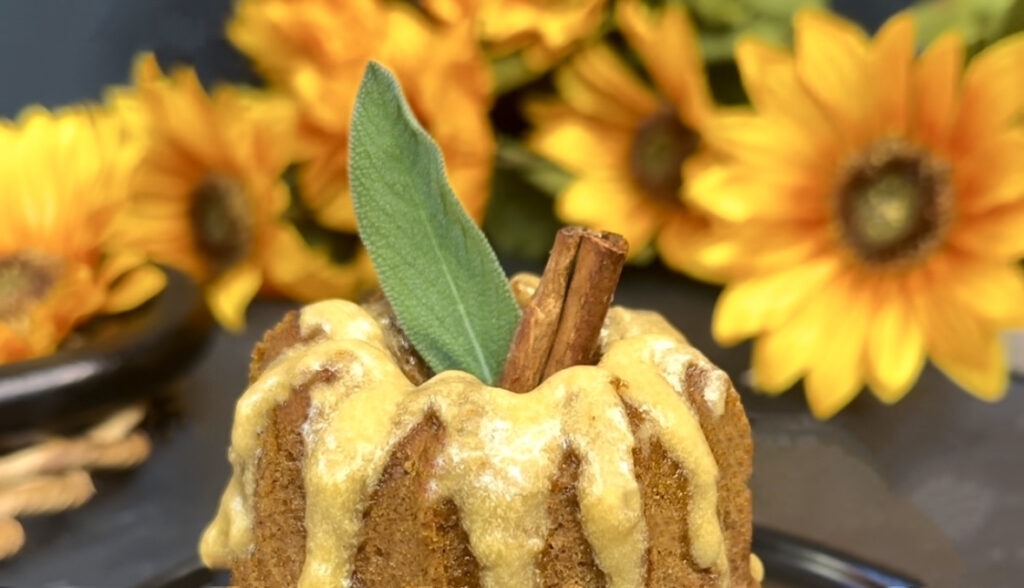 sage leaf and cinnamon stick stem on maple pumpkin cake