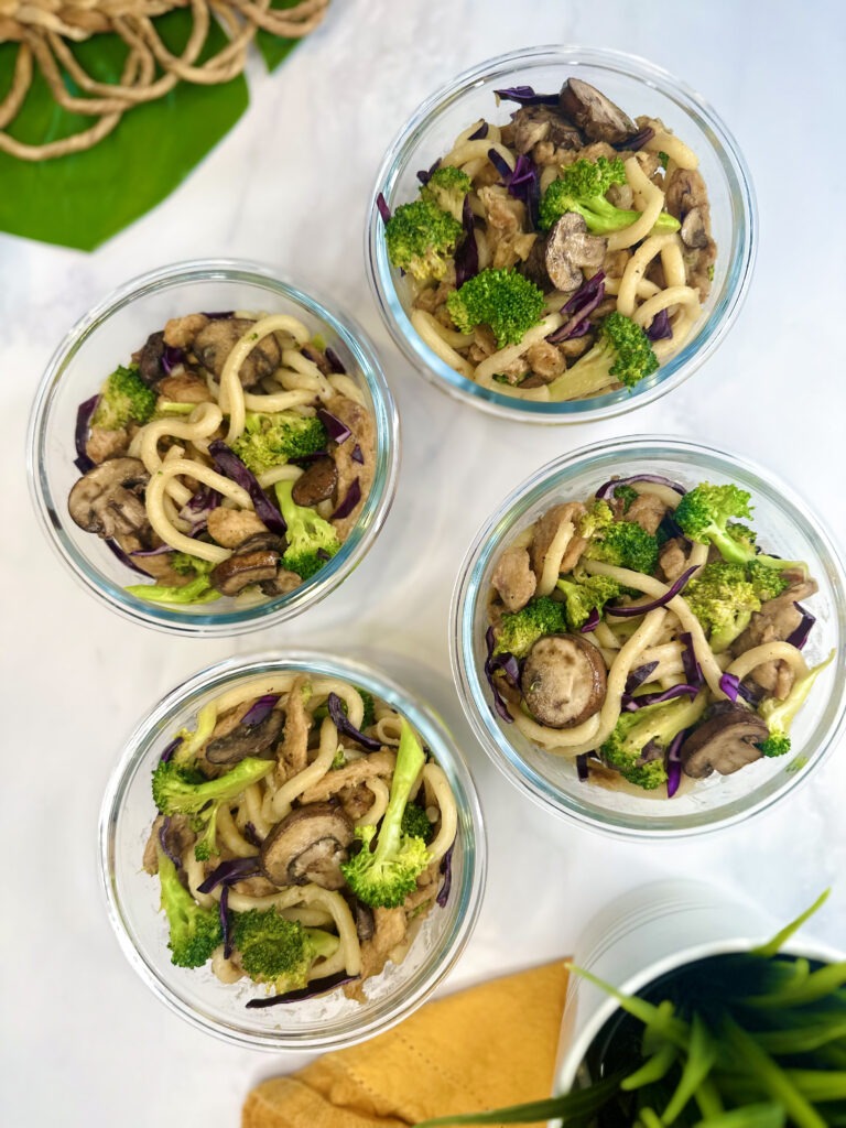 Vegan Beef and Broccoli Udon Noodle Meal Prep: containers with udon noodles, beef soy curls, mushrooms, broccoli and cabbage