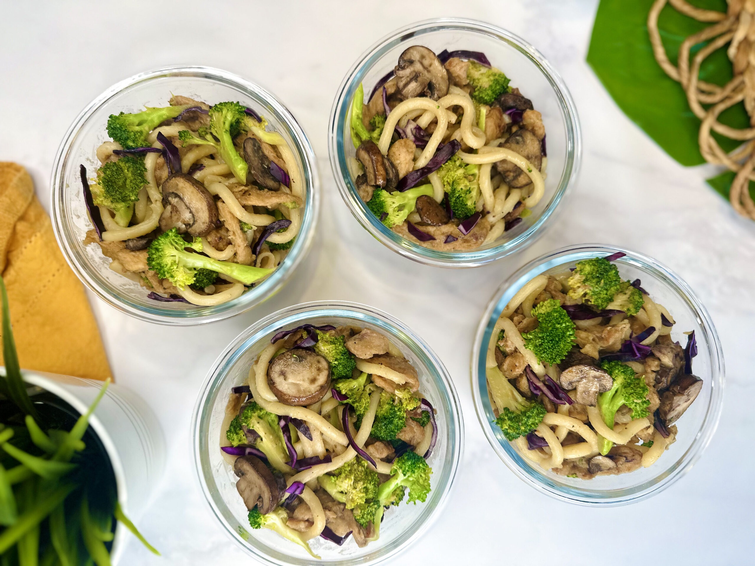 vegan beef and broccoli udon noodle meal prep in containers