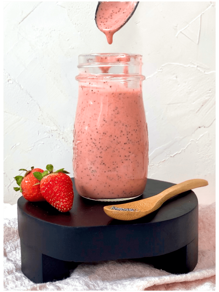 a vibrant pink strawberry poppyseed dressing