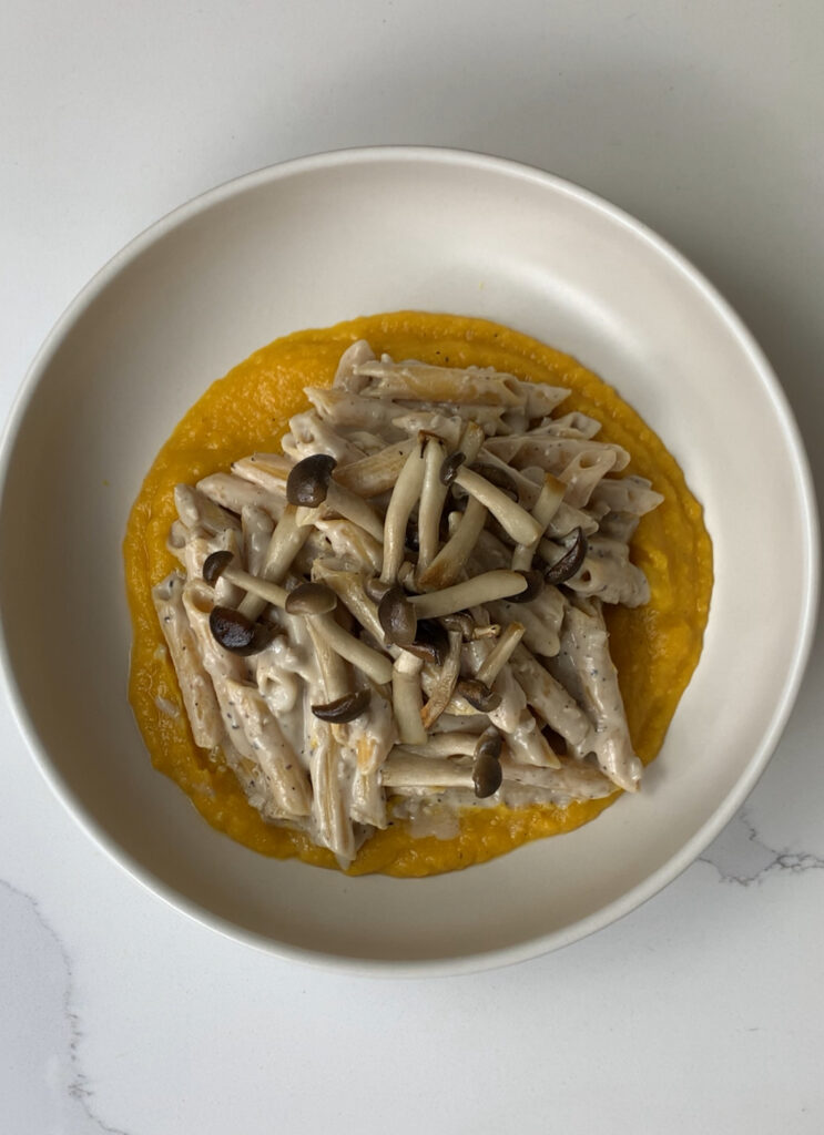 carbonara pasta with mushrooms added on top