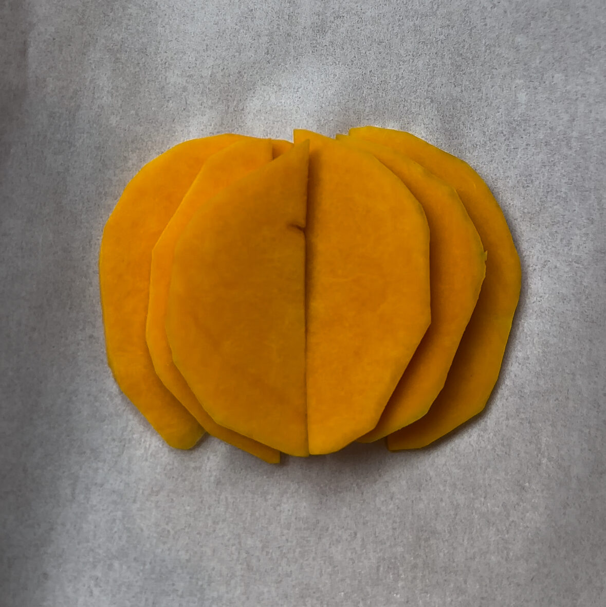 Butternut squash slices arranged to make pumpkin shape 