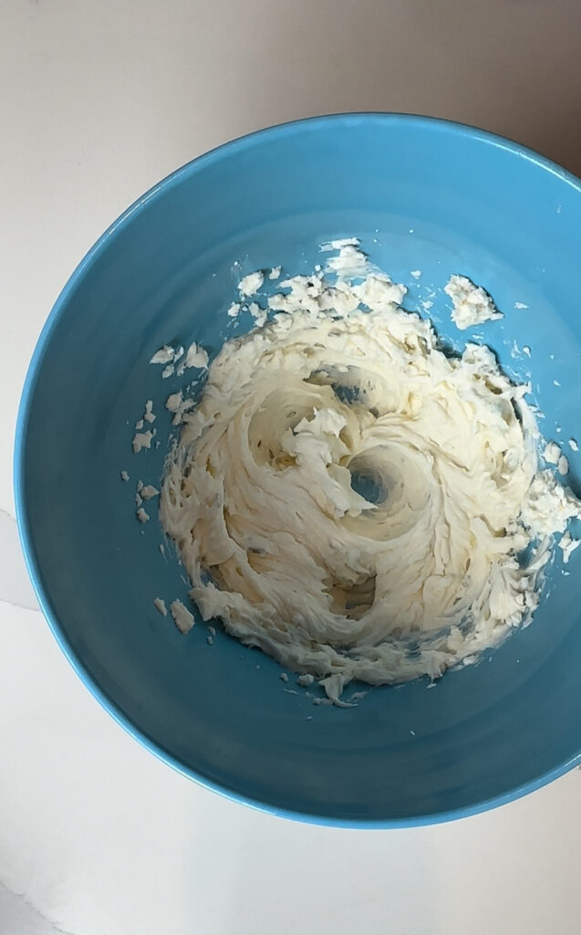 fluffy whipped cream cheese in a mixing bowl