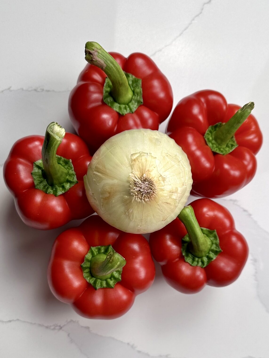 5 red peppers used for these Moroccan Inspired Stuffed Bell Peppers