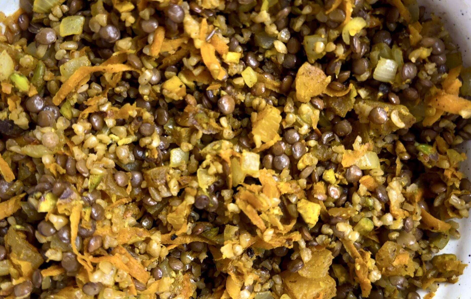 The stuffed pepper filling of lentils, bulgur, onions, carrots, dried apricots, crushed pistachios and spices.