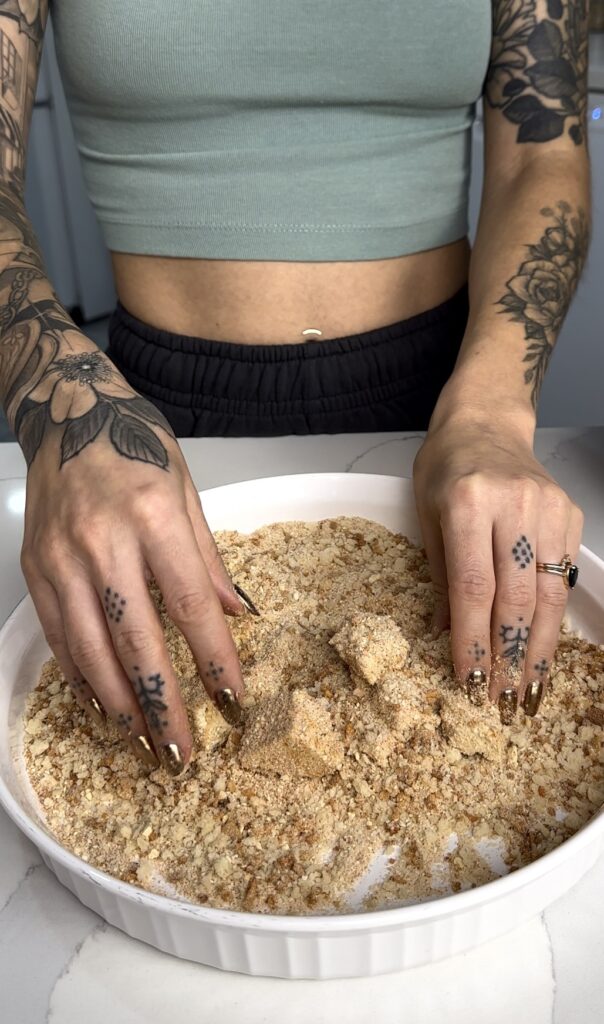 toss tofu pieces in the breadcrumb mixture