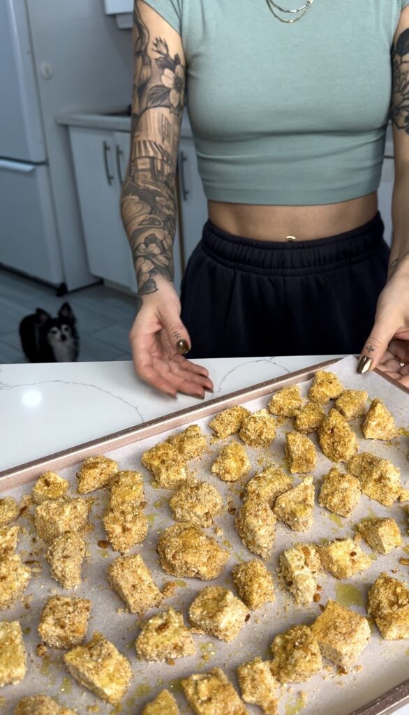 add crispy tofu to a baking sheet lined with parchment paper