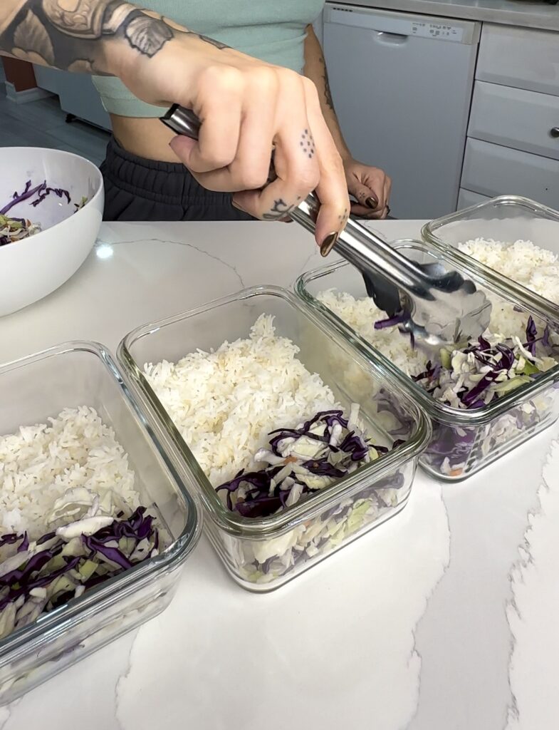 meal prep: add rice and coleslaw to the meal prep containers 