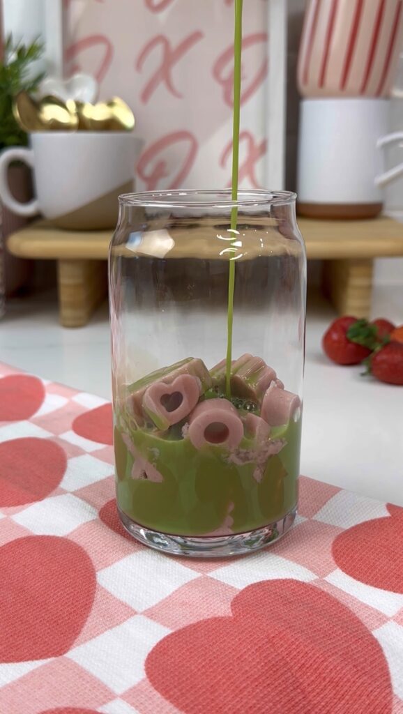 matcha added to cub with strawberry milk ice cubes