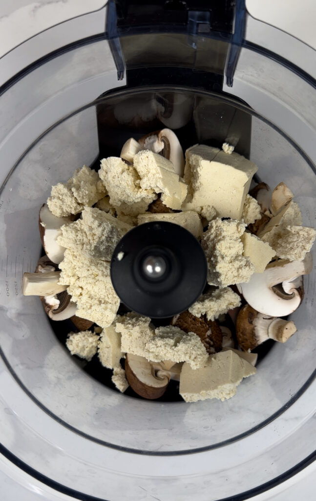 food processor with tofu and mushrooms