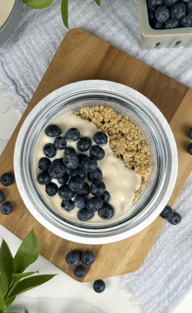 overhead shot of breakfast prep with shortcake, vanilla yogurt and fresh blueberries.