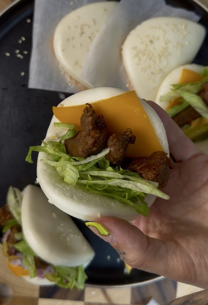 fluffy bao with cheddar cheese, beyond beef, and lettuce