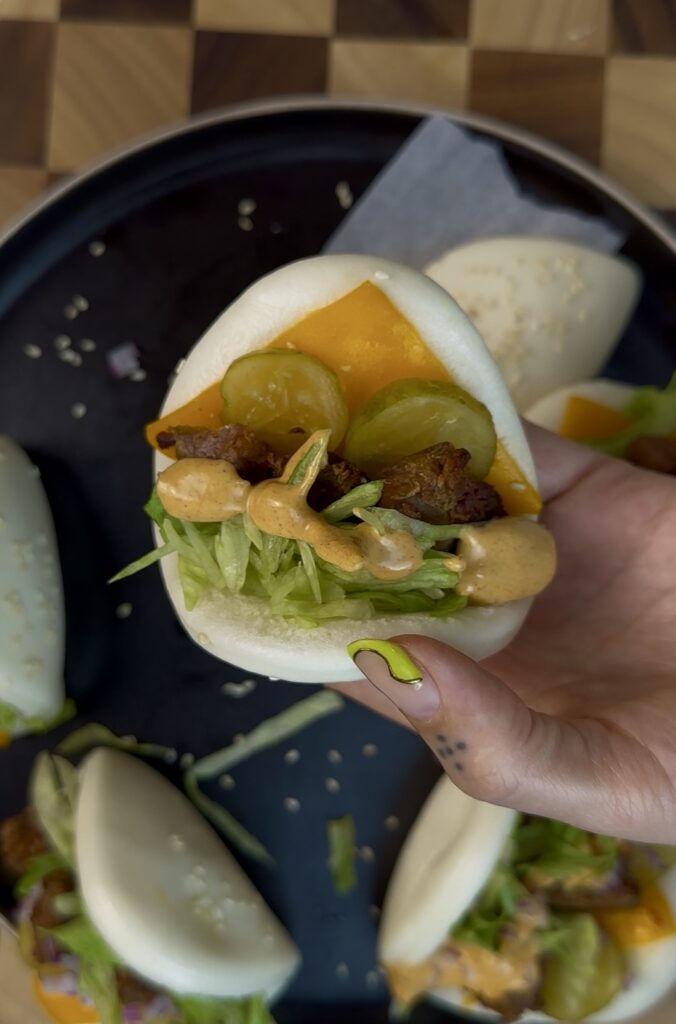 fluffy bao with cheddar cheese, beyond beef, lettuce, pickles and Big Mac sauce 