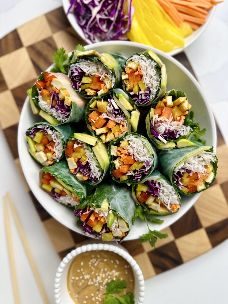 bowl of fresh summer rolls cut in half 