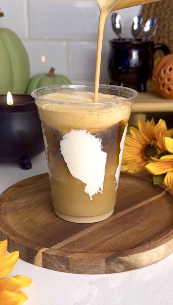 adding pumpkin cold foam to toasted marshmallow latte