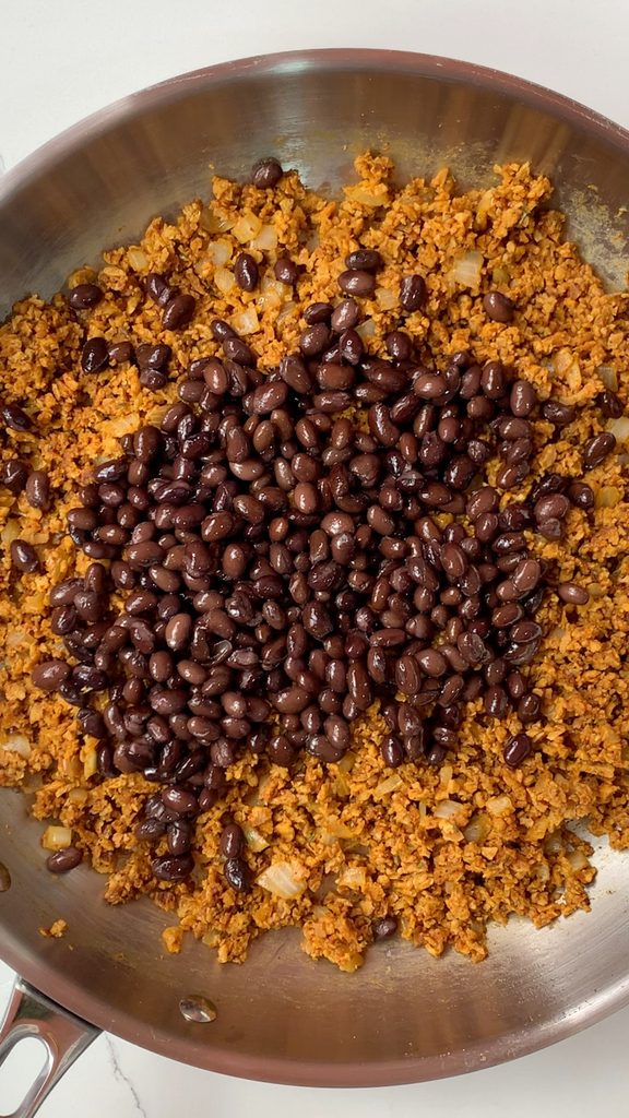 Add black beans to the TVP mixture.
