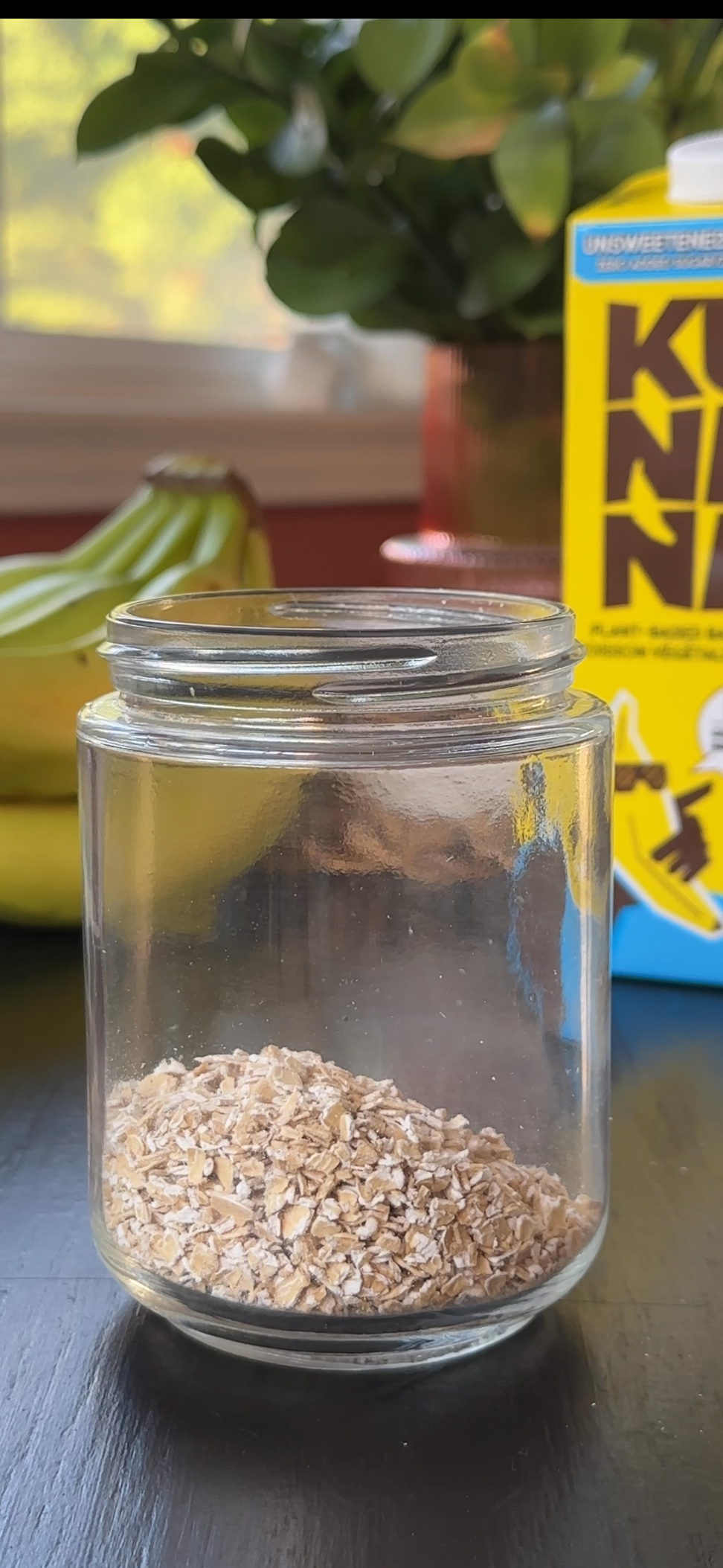 adding oats to the meal prep jar