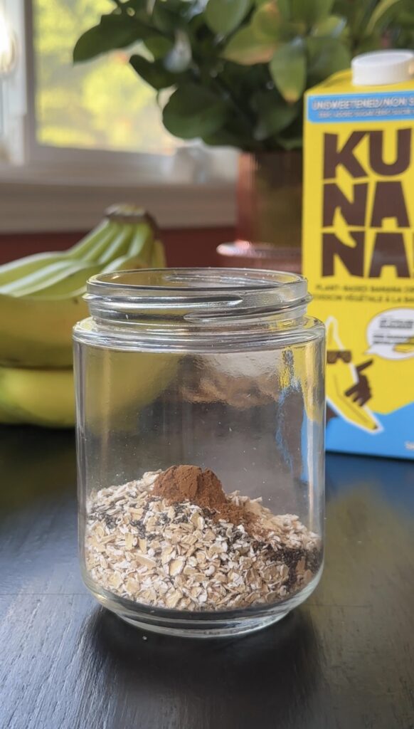 adding cinnamon and nutmeg to the meal prep jar