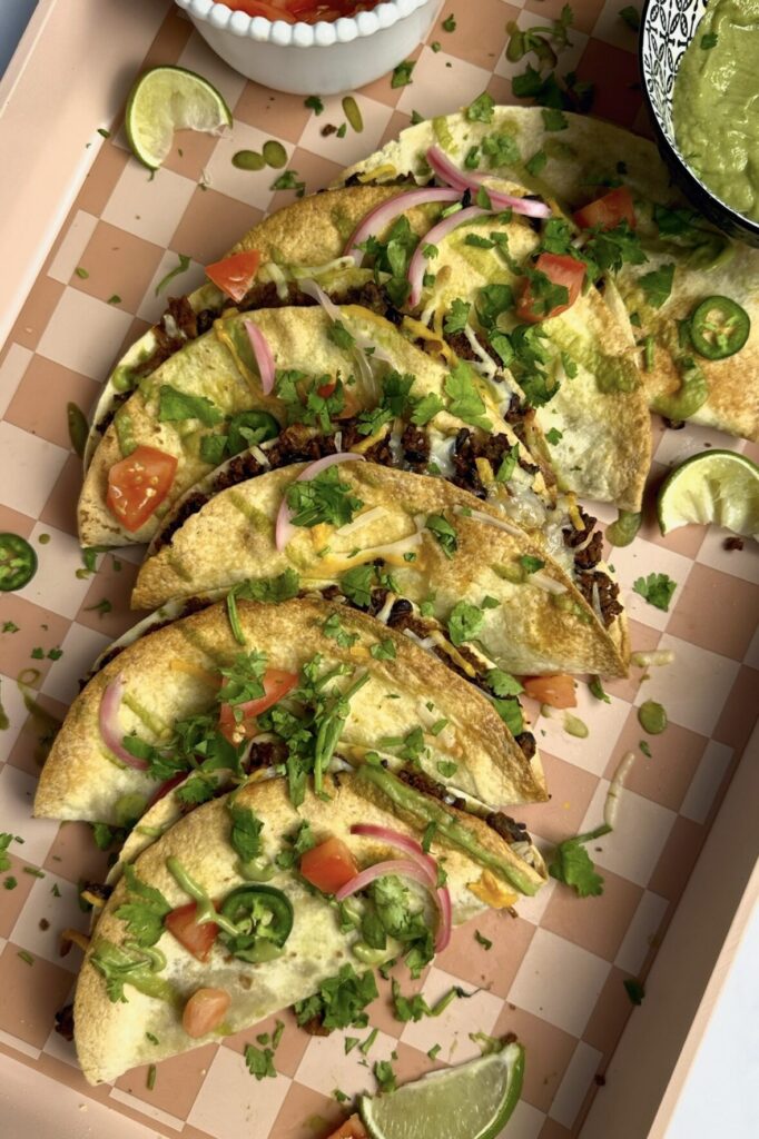 Tray of 8 black bean & TVP tacos with fresh toppings: cilantro, diced red tomatoes and pickled red onion