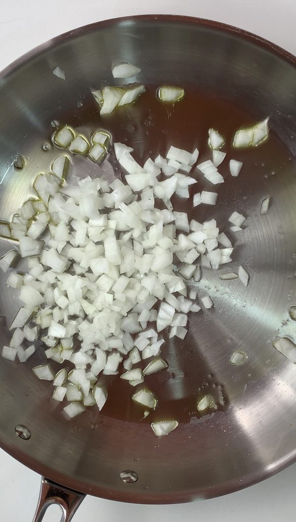 Pan with oil and diced onion